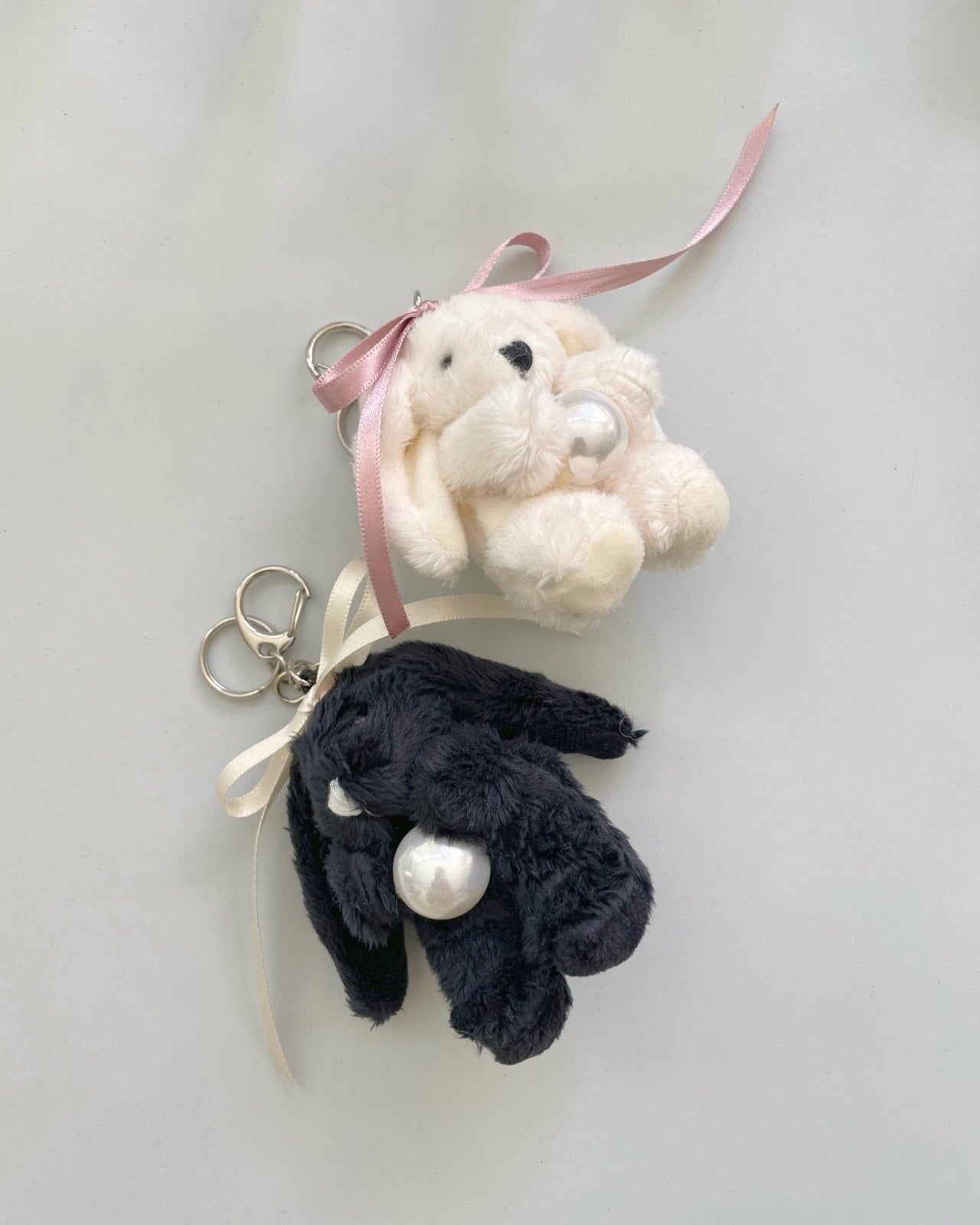 Rabbit Holding Pearl Keychain